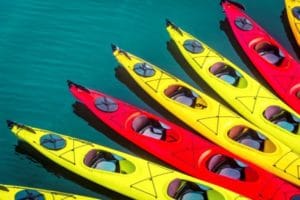 different kayaks in water