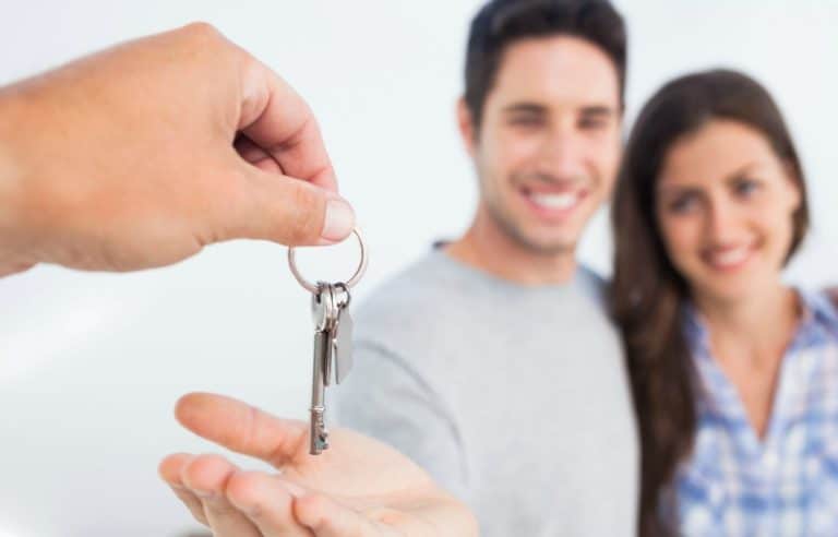 Couple Being Handed New House Key